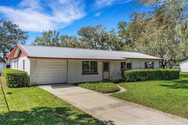 single story home featuring metal roof, brick siding, and a front lawn