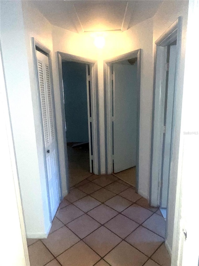 hallway featuring tile patterned floors