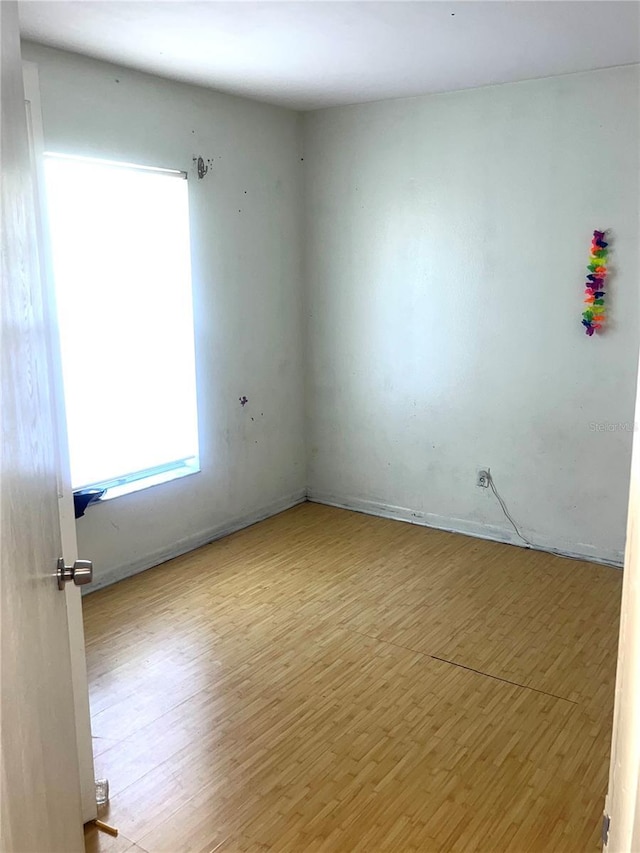 empty room with wood finished floors