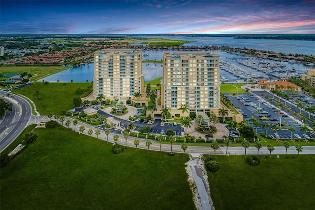 aerial view at dusk with a water view