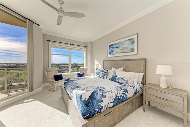 bedroom with baseboards, a ceiling fan, crown molding, and carpet flooring