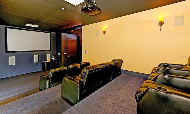 home theater room featuring carpet floors and baseboards