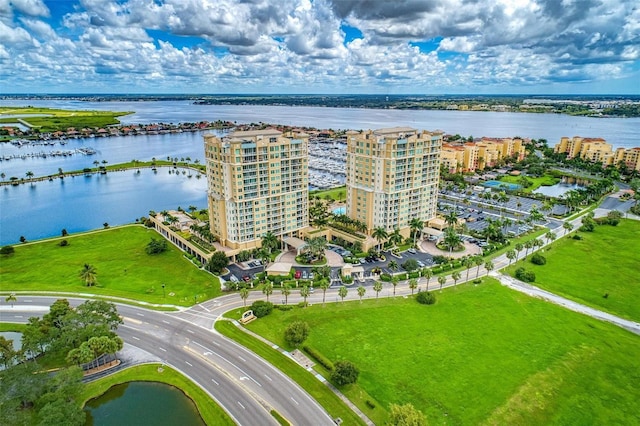 bird's eye view featuring a water view and a city view