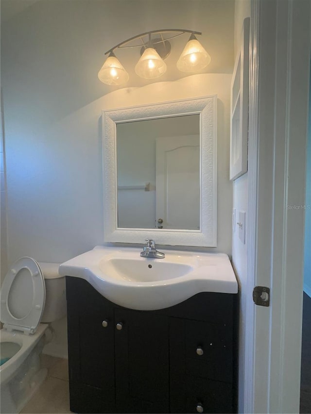 half bath with vanity and toilet