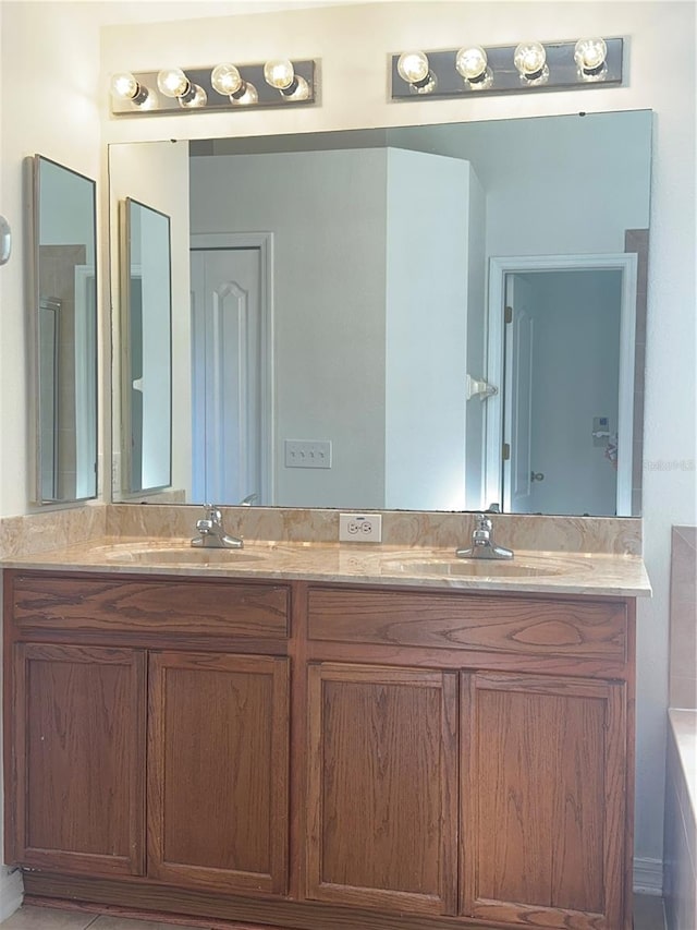 bathroom featuring double vanity and a sink