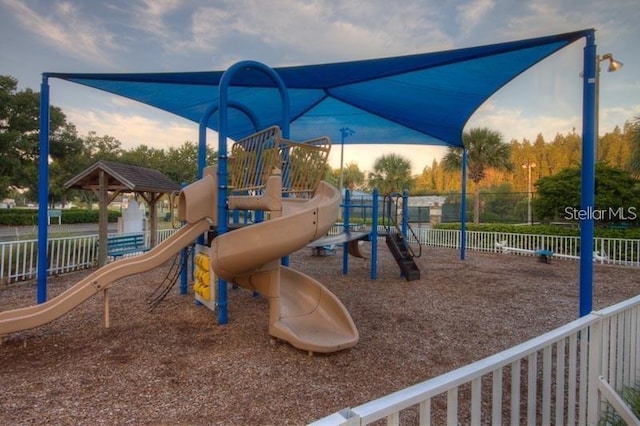 community jungle gym with fence