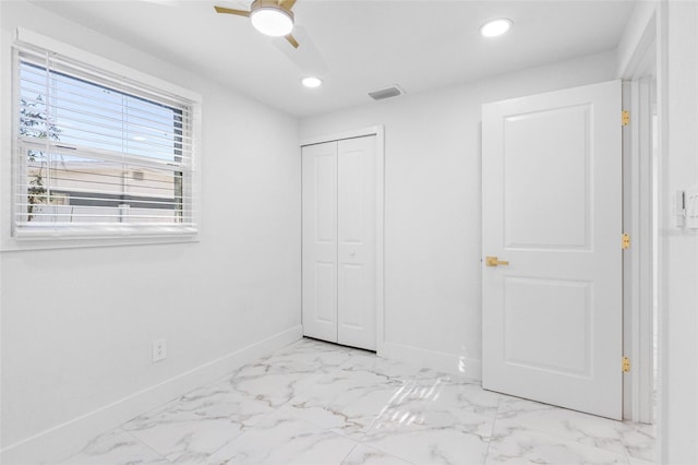 unfurnished bedroom featuring a closet, recessed lighting, visible vents, and baseboards