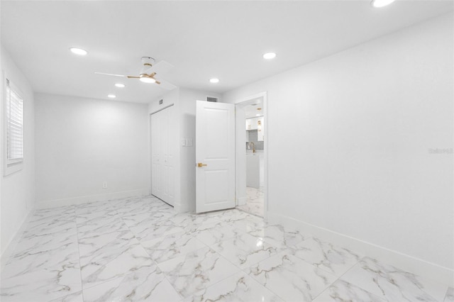 spare room with ceiling fan, recessed lighting, visible vents, and baseboards