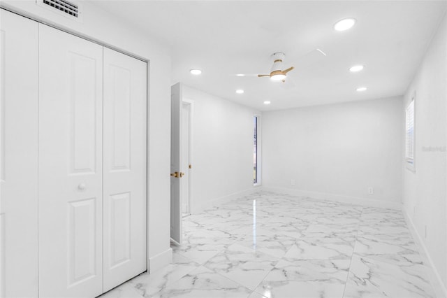 basement featuring ceiling fan, recessed lighting, visible vents, baseboards, and marble finish floor