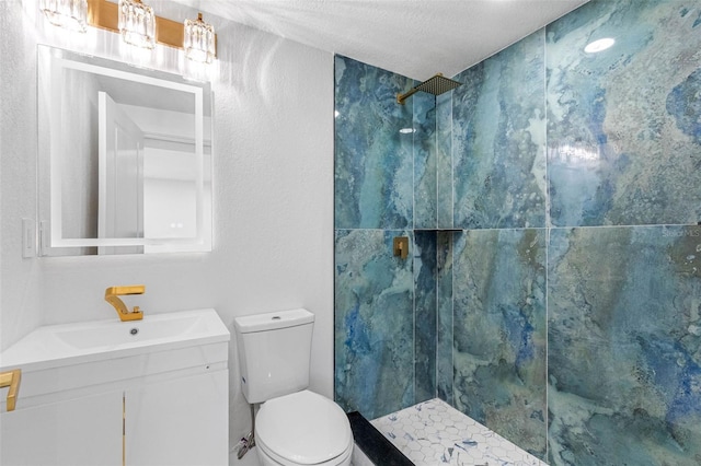 full bathroom with a textured ceiling, vanity, a marble finish shower, and toilet