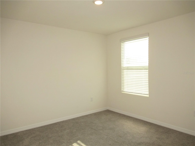 empty room with recessed lighting, carpet flooring, and baseboards