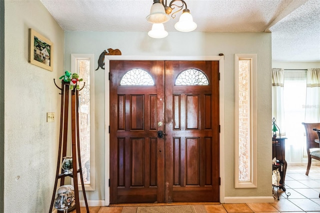 105 Country Club Ln, Mulberry, FL 33860 - entryway featuring plenty of natural light, light tile patterned floors, and a textured ceiling