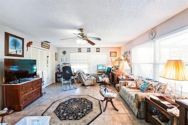 105 Country Club Ln, Mulberry, FL 33860 - living room with a textured ceiling, tile patterned floors, and ceiling fan