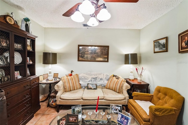 105 Country Club Ln, Mulberry, FL 33860 - living area with light tile patterned floors, visible vents, a textured ceiling, and a ceiling fan