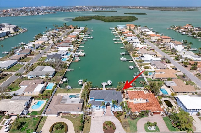 bird's eye view featuring a water view and a residential view