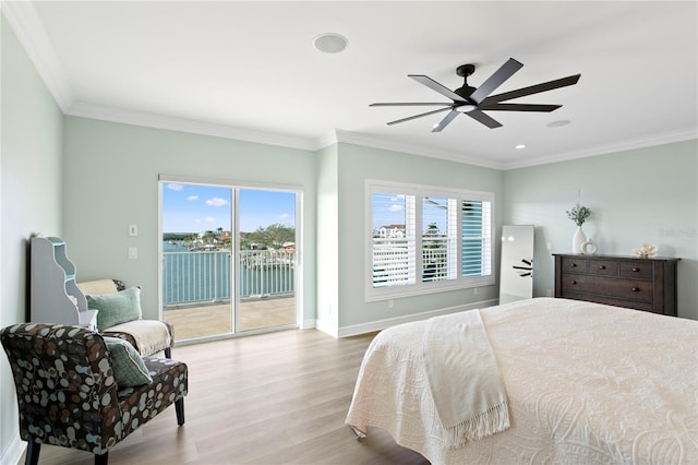 bedroom with access to exterior, multiple windows, and ornamental molding