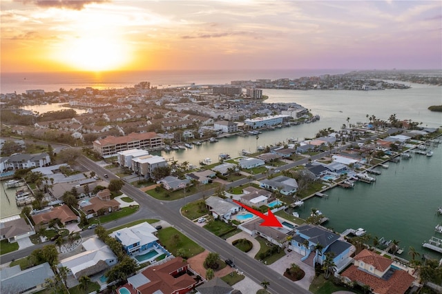 aerial view at dusk with a water view