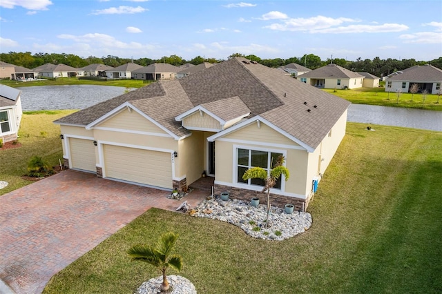 ranch-style house featuring stone siding, a residential view, a front lawn, and decorative driveway