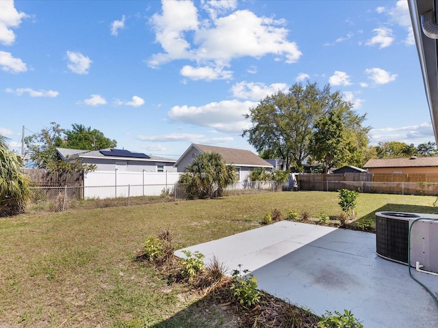 view of yard with cooling unit, a patio area, and a fenced backyard