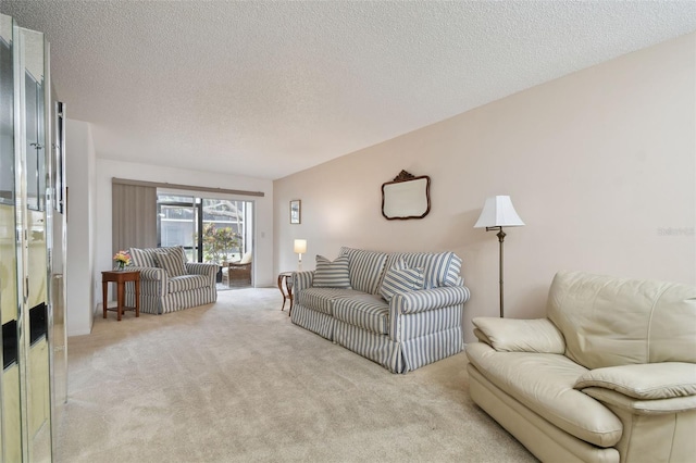 living room with light carpet and a textured ceiling