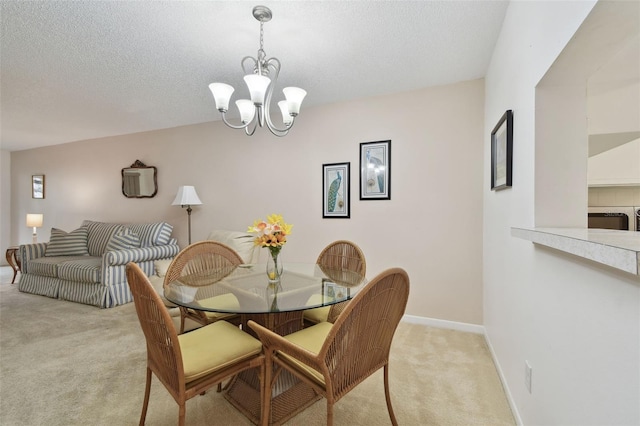 dining room with light carpet, a textured ceiling, an inviting chandelier, and baseboards