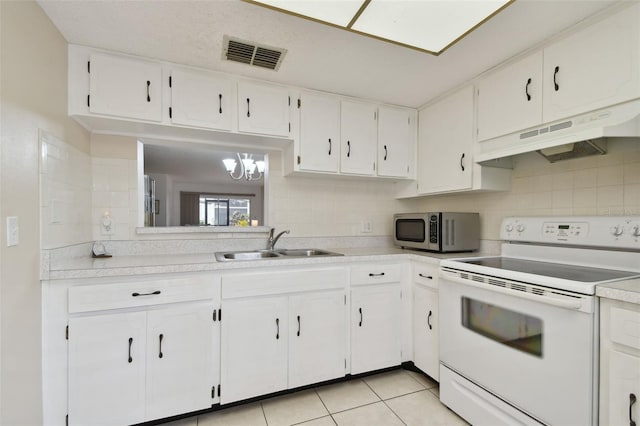 kitchen with visible vents, stainless steel microwave, white electric range, under cabinet range hood, and a sink