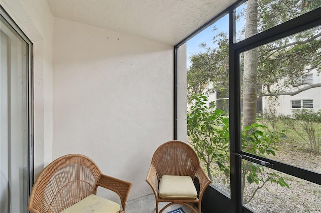 sunroom featuring lofted ceiling