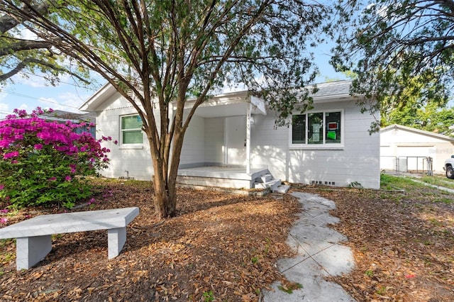 ranch-style home with crawl space and a shingled roof