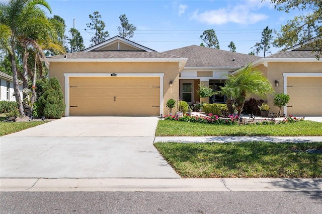 ranch-style home featuring a garage, concrete driveway, roof with shingles, and stucco siding