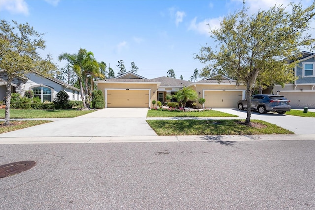 single story home with a garage, driveway, a front lawn, and stucco siding