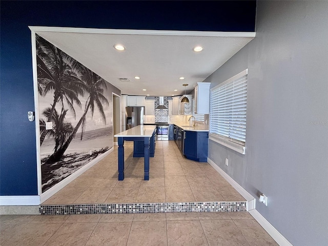 rec room featuring visible vents, baseboards, light tile patterned floors, recessed lighting, and a sink