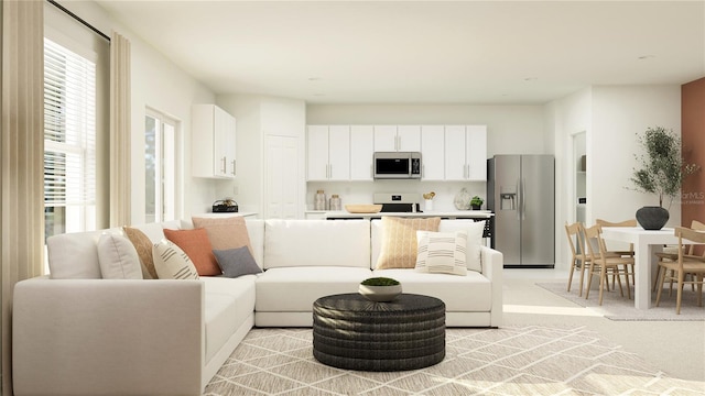 living area featuring light carpet and arched walkways