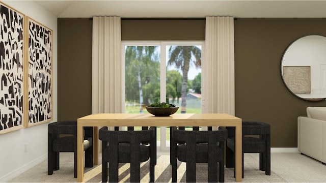 carpeted dining area featuring baseboards