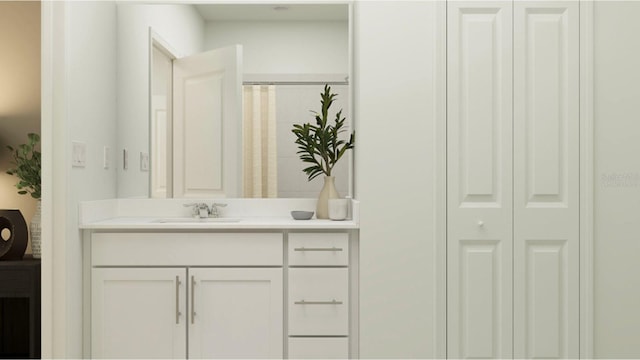 bathroom with a closet and vanity