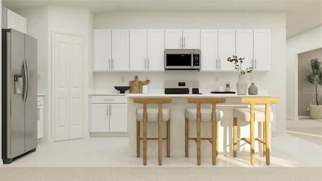 kitchen with a breakfast bar, stainless steel refrigerator with ice dispenser, light tile patterned floors, stove, and white cabinetry