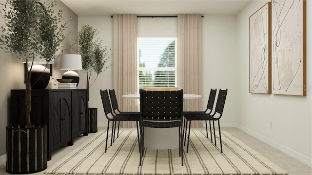 carpeted dining space featuring baseboards