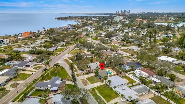 drone / aerial view with a water view and a residential view