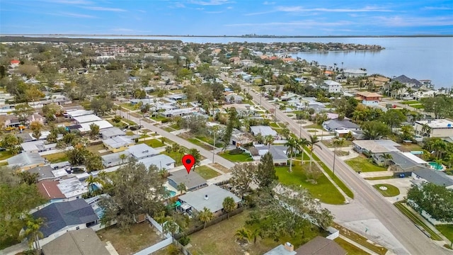 birds eye view of property featuring a water view and a residential view