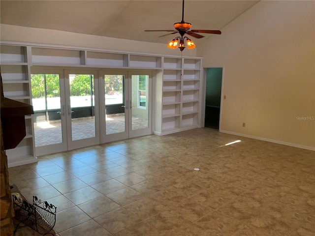 tiled empty room with french doors, a ceiling fan, and baseboards