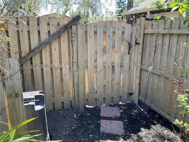 view of gate featuring fence