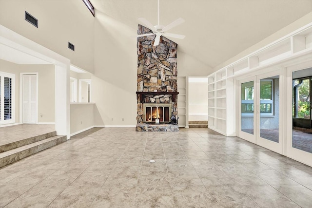 11712 Palmer Dr, Tampa, FL 33624 - unfurnished living room with french doors, a ceiling fan, tile patterned flooring, high vaulted ceiling, and built in features