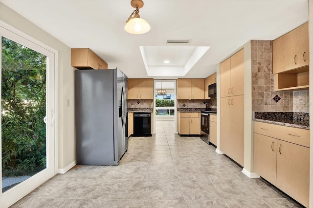 11712 Palmer Dr, Tampa, FL 33624 - kitchen with black appliances, a raised ceiling, tasteful backsplash, and light brown cabinetry
