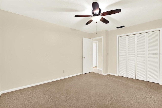 11712 Palmer Dr, Tampa, FL 33624 - unfurnished bedroom featuring carpet floors, a closet, and a ceiling fan
