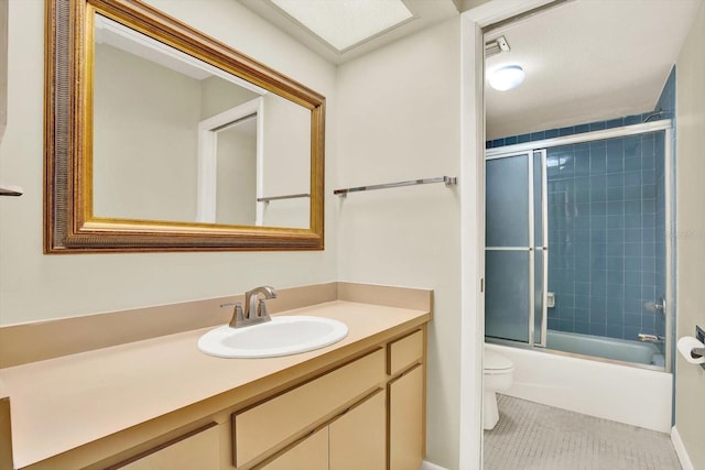 11712 Palmer Dr, Tampa, FL 33624 - full bathroom with vanity, combined bath / shower with glass door, and tile patterned flooring