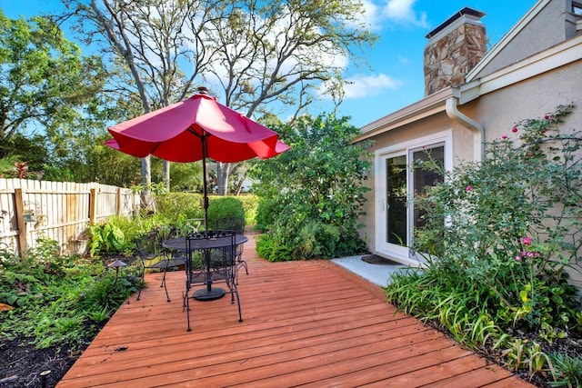 11712 Palmer Dr, Tampa, FL 33624 - wooden deck featuring outdoor dining area