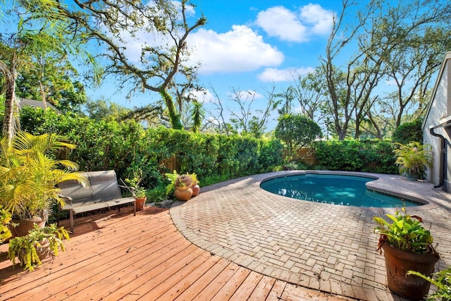 11712 Palmer Dr, Tampa, FL 33624 - view of swimming pool featuring a fenced backyard and a wooden deck
