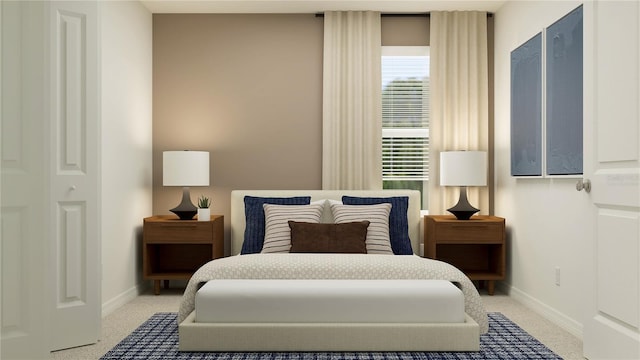 bedroom with light colored carpet and baseboards