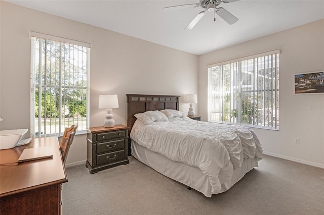 bedroom with carpet floors, ceiling fan, and baseboards