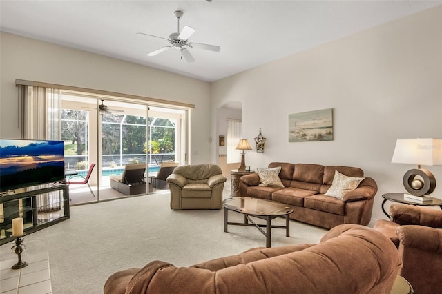 living area with carpet floors, a sunroom, and ceiling fan