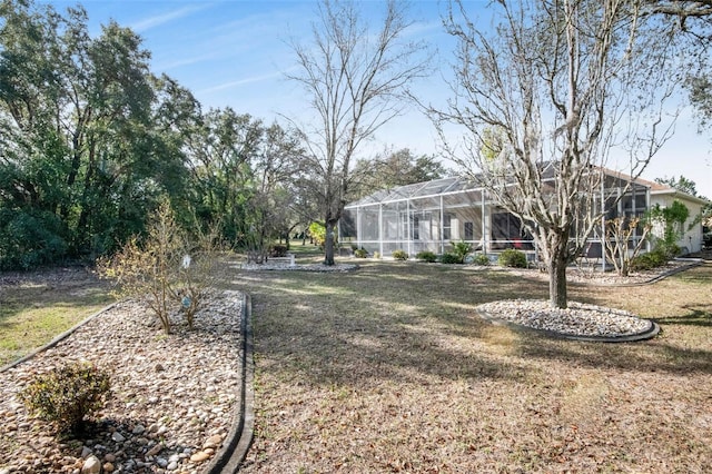 view of yard with a lanai